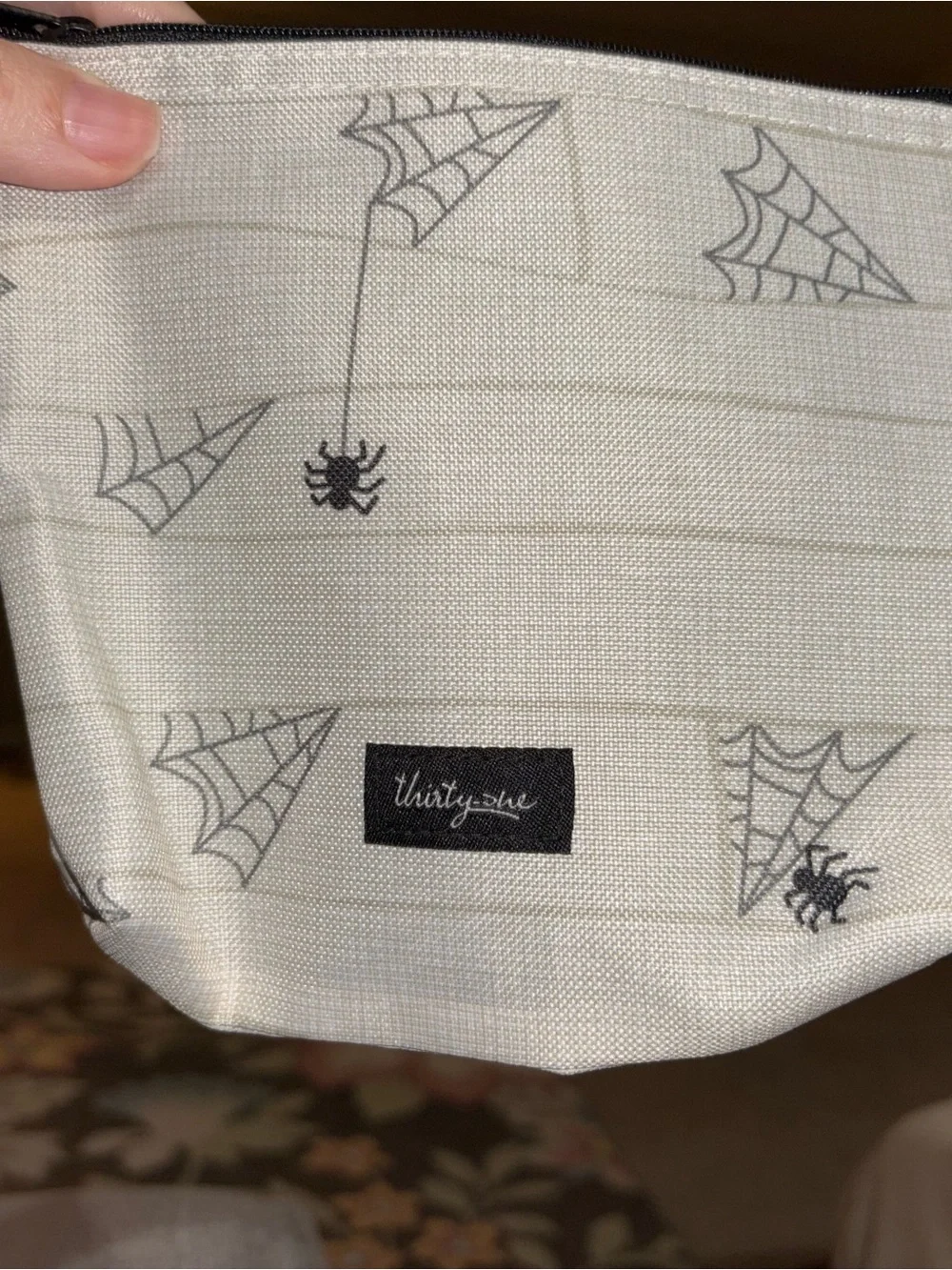 thirty-one White Mummy Face Wristlet with Yellow Eyes